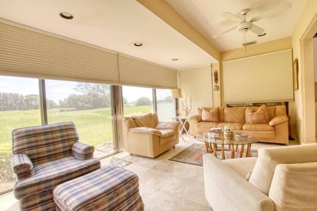 interior space with ceiling fan and a wealth of natural light