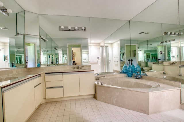 bathroom featuring tile patterned flooring, vanity, and independent shower and bath