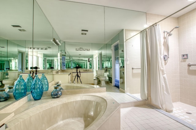 bathroom with plus walk in shower, tile patterned floors, and toilet