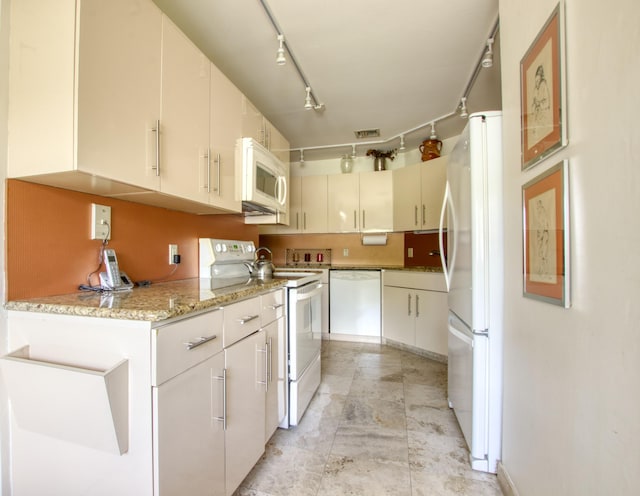 kitchen with white cabinets, white appliances, and track lighting