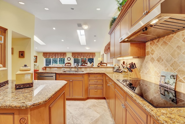 kitchen featuring light tile floors, a skylight, kitchen peninsula, dishwasher, and sink