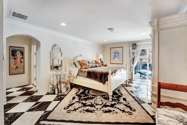 bedroom featuring light tile floors, a textured ceiling, and ornamental molding