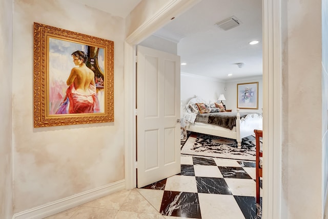 hallway featuring ornamental molding and light tile floors