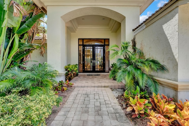 view of exterior entry featuring french doors