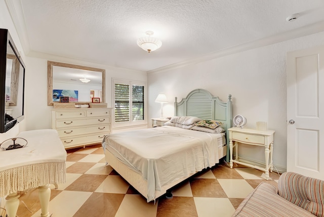 tiled bedroom with a textured ceiling and crown molding