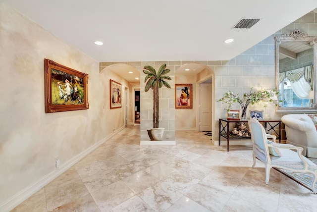 4590 Live Oak Blvd, Delray Beach, FL 33445 - corridor featuring arched walkways, baseboards, recessed lighting, and visible vents