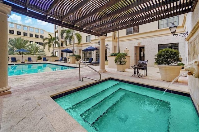 view of pool with a patio and a pergola