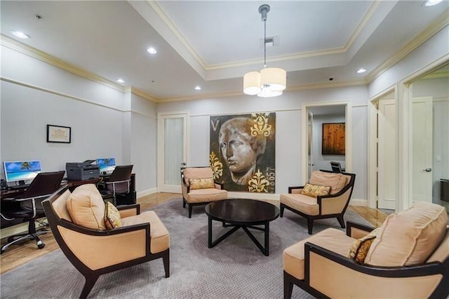 living area featuring a raised ceiling and crown molding