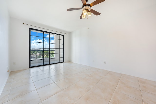 empty room with light tile patterned floors and ceiling fan