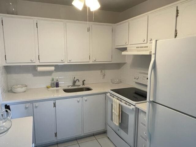 kitchen with ventilation hood, ceiling fan, tasteful backsplash, white appliances, and white cabinetry