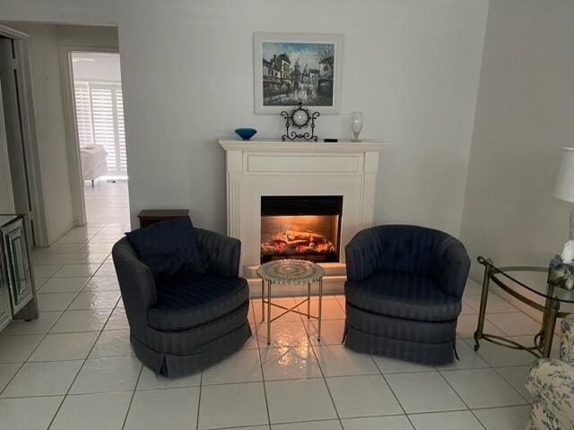 sitting room featuring light tile flooring