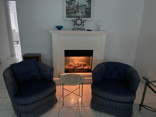 sitting room featuring light tile floors