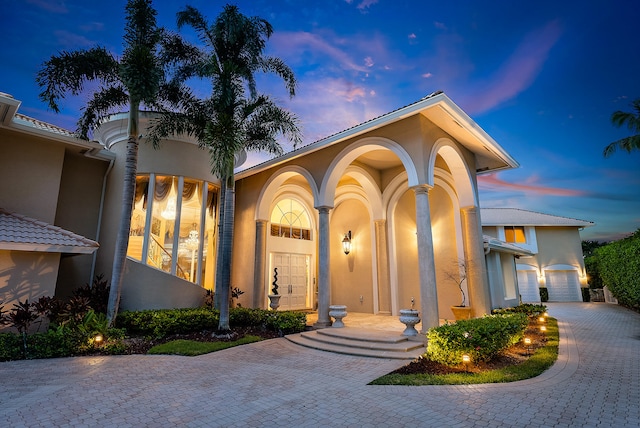 mediterranean / spanish house featuring a garage