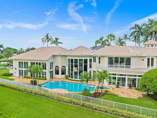 view of pool with a lawn and a patio area