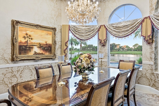 dining room featuring tile floors and a notable chandelier