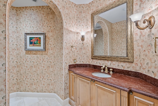 bathroom with vanity and tile flooring