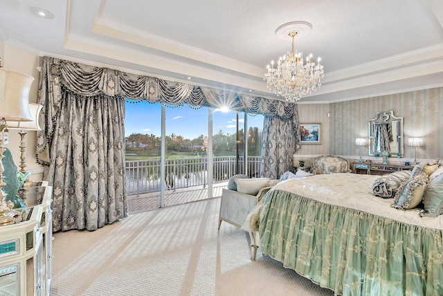 carpeted bedroom with a tray ceiling, access to outside, a notable chandelier, and crown molding