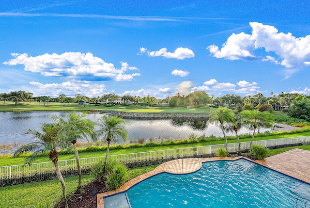 view of pool with a water view