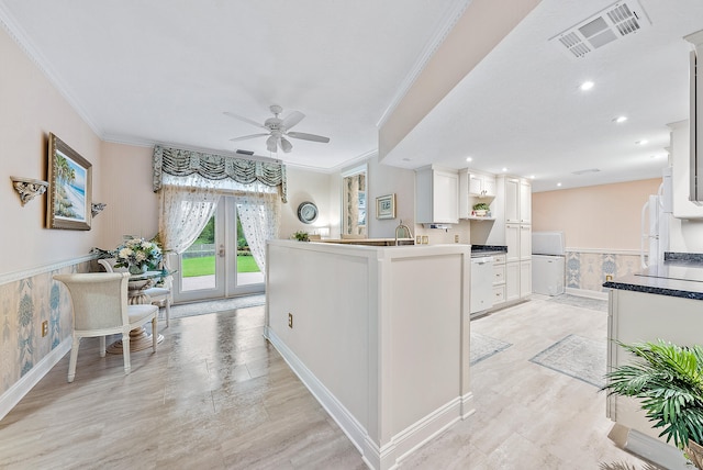 kitchen featuring ceiling fan, french doors, white appliances, crown molding, and white cabinets