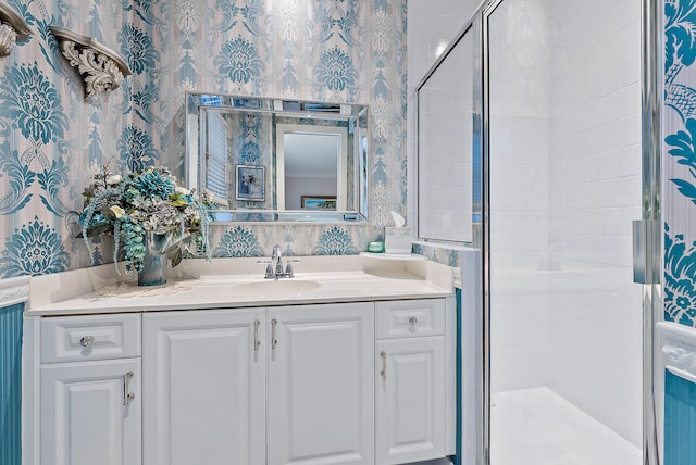 bathroom featuring an enclosed shower and vanity