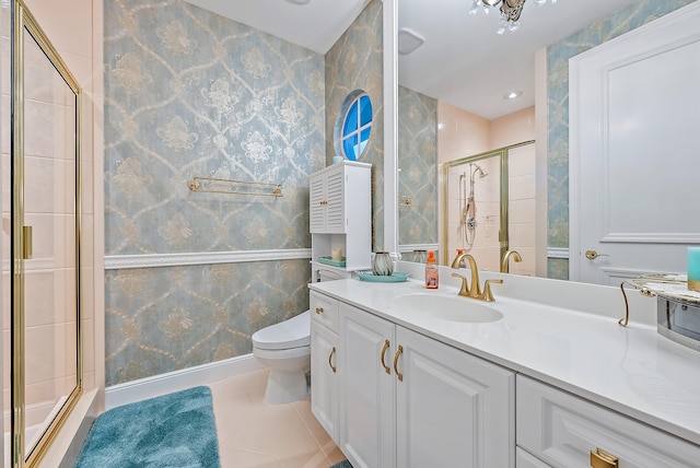 bathroom featuring walk in shower, tile flooring, vanity with extensive cabinet space, and toilet