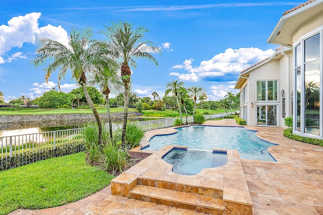 view of swimming pool with an in ground hot tub and a patio area