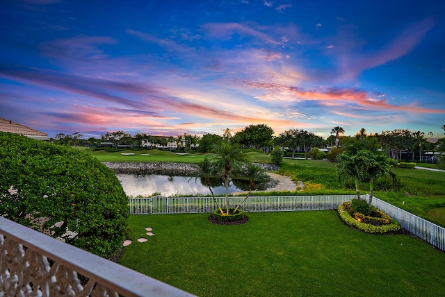 yard at dusk with a water view