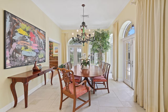 dining area featuring crown molding, french doors, an inviting chandelier, and light tile floors