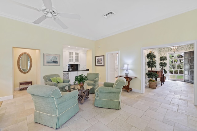 living room with light tile floors, ornamental molding, and ceiling fan