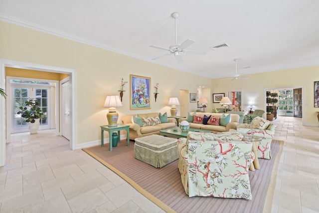 living room with ornamental molding, ceiling fan, and light tile floors