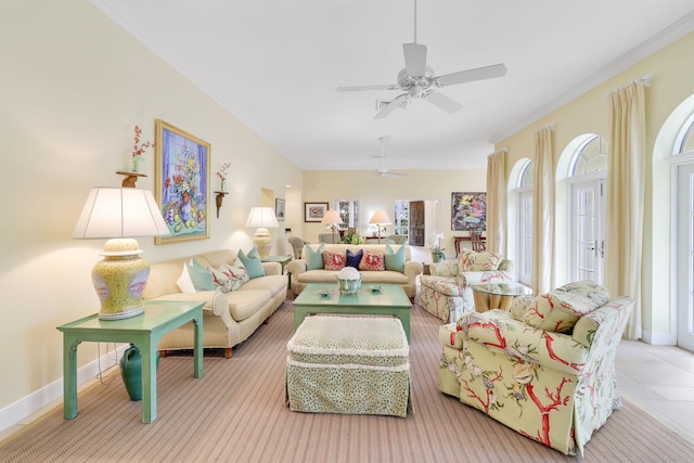 tiled living room with a healthy amount of sunlight, ceiling fan, and crown molding