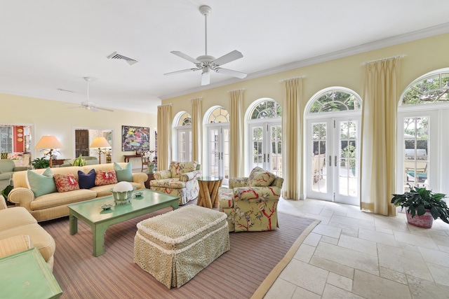 living room with french doors, ceiling fan, light tile flooring, and ornamental molding