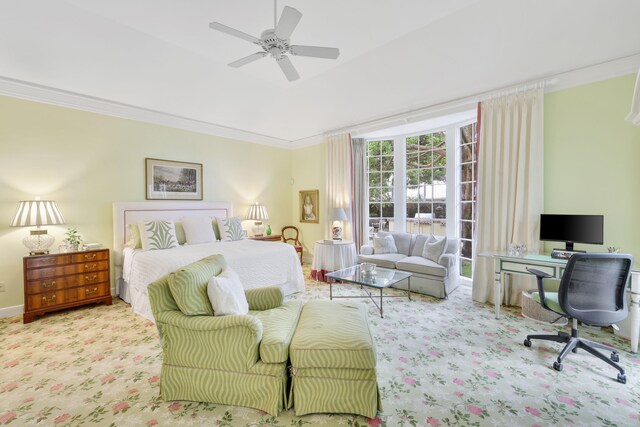 carpeted bedroom with ceiling fan and ornamental molding