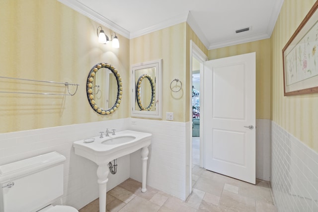 bathroom with tile walls, toilet, and tile flooring