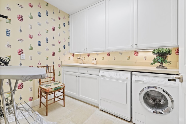 laundry area with washer and dryer, light tile floors, cabinets, and sink