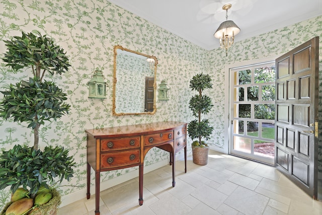 doorway featuring light tile floors, an inviting chandelier, and ornamental molding