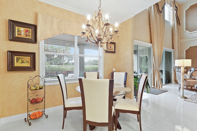 dining area with a notable chandelier, crown molding, and light tile floors