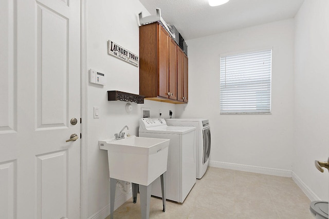 laundry area featuring cabinets, light tile flooring, hookup for a washing machine, independent washer and dryer, and hookup for an electric dryer