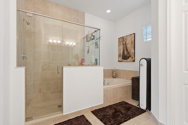 bathroom featuring tile floors and shower with separate bathtub