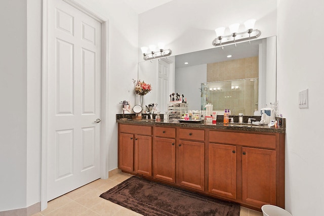 bathroom with an enclosed shower, double vanity, and tile flooring