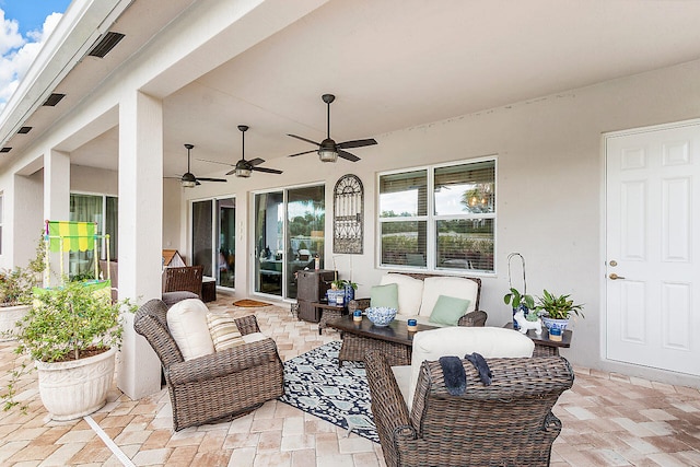 view of patio featuring outdoor lounge area and ceiling fan