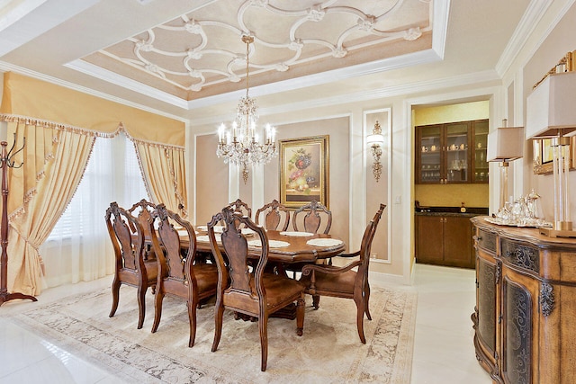 tiled dining space featuring a tray ceiling, a chandelier, and crown molding