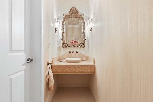 bathroom with tile flooring and vanity