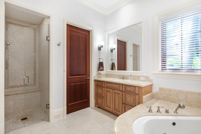 bathroom featuring tile floors, crown molding, vanity with extensive cabinet space, and separate shower and tub