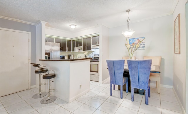 kitchen featuring kitchen peninsula, appliances with stainless steel finishes, ornamental molding, pendant lighting, and range hood