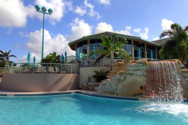 view of pool featuring pool water feature