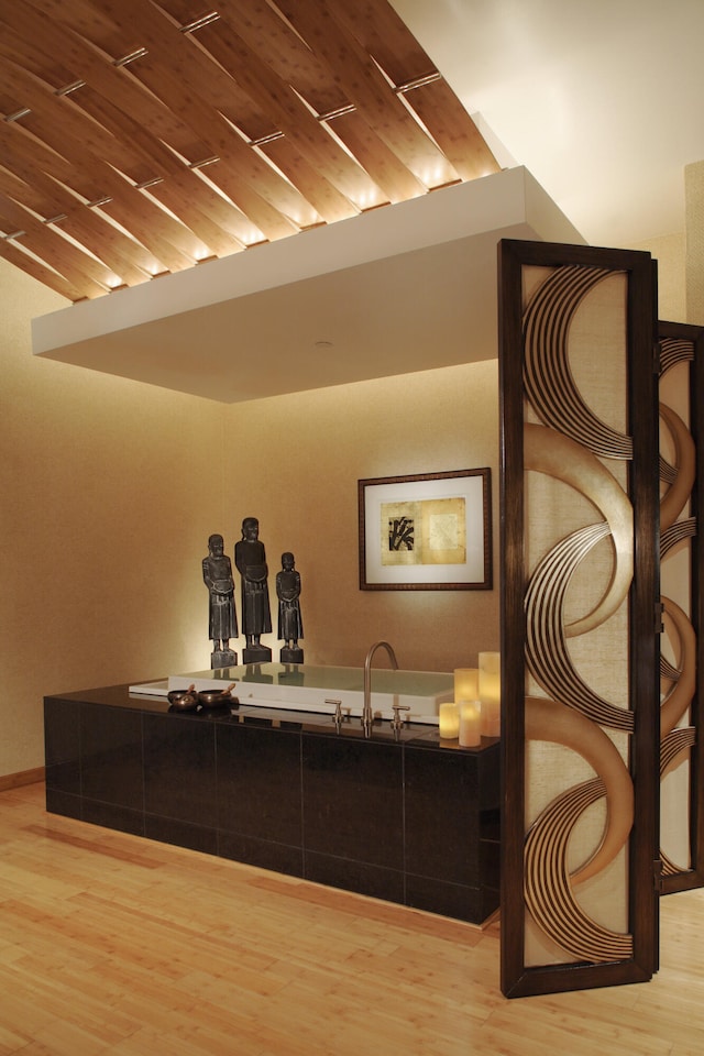 bathroom featuring wood-type flooring and wooden ceiling