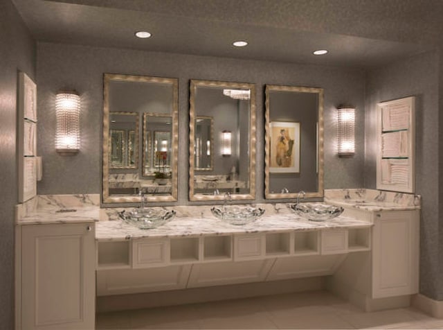 bathroom featuring tile floors and oversized vanity