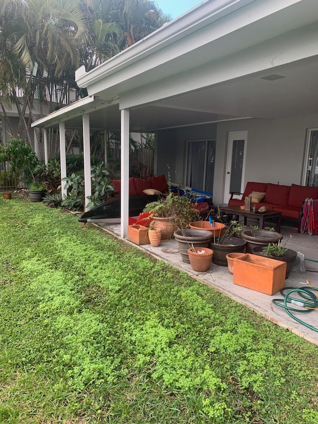 view of yard with an outdoor living space and a patio area