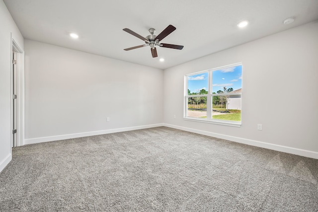 spare room with carpet flooring and ceiling fan